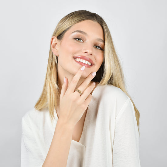 BAGUE FEMME EN ACIER DORÉ AVEC CRISTAUX BLANCS ET SPHÈRES