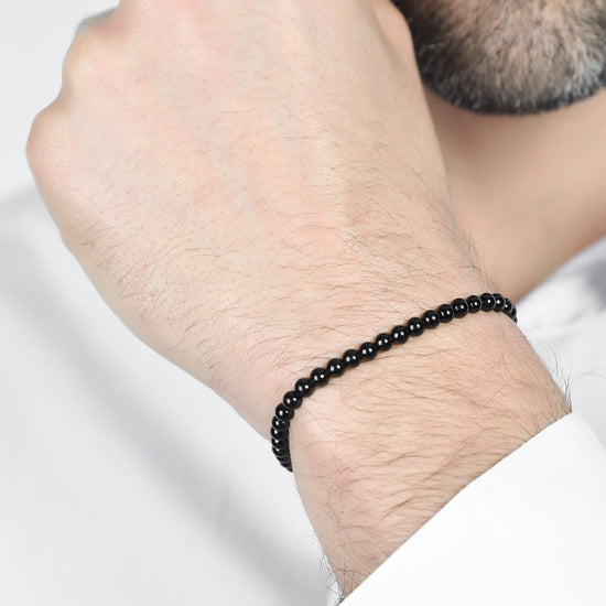 BRACELET POUR HOMME EN ACIER AVEC PERLES NOIRES