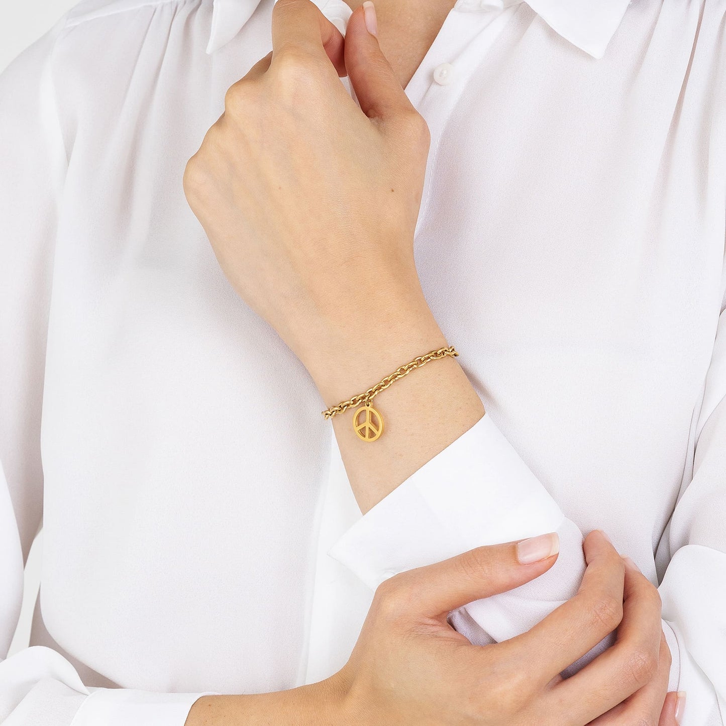 BRACELET POUR FEMME EN ACIER PLAQUÉ OR AVEC SYMBOLE DE LA PAIX