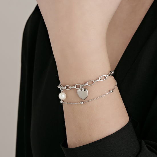 BRACELET EN ACIER POUR FEMME AVEC CŒUR ET PERLES