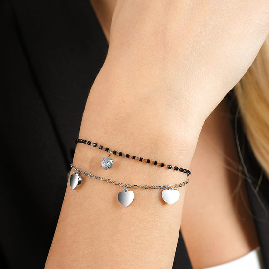 BRACELET EN ACIER POUR FEMME AVEC CŒURS, ÉLÉMENTS NOIRS ET CRISTAL BLANC