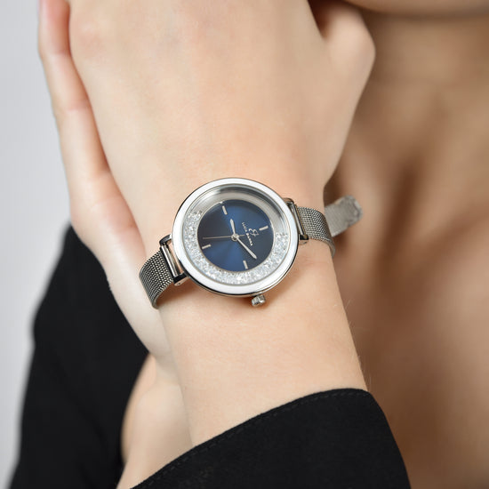 MONTRE POUR DAMES AVEC BOÎTIER EN ACIER ET LUNETTE EN CÉRAMIQUE BLANCHE