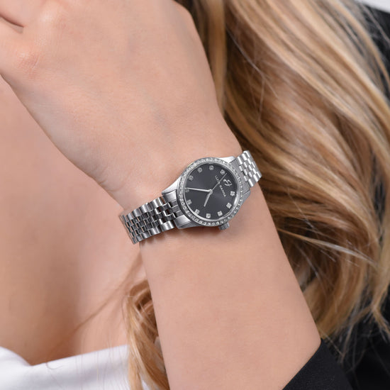 MONTRE EN ACIER POUR DAMES AVEC CADRAN NOIR ET LUNETTE EN CRISTAL BLANC