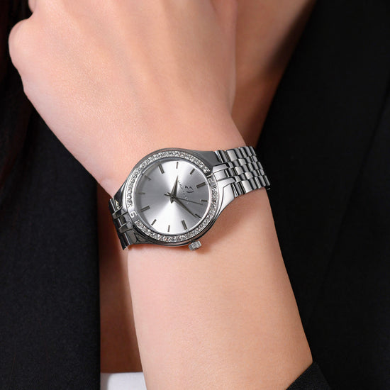 MONTRE FEMME EN ACIER AVEC LUNETTE EN CRISTAL BLANC