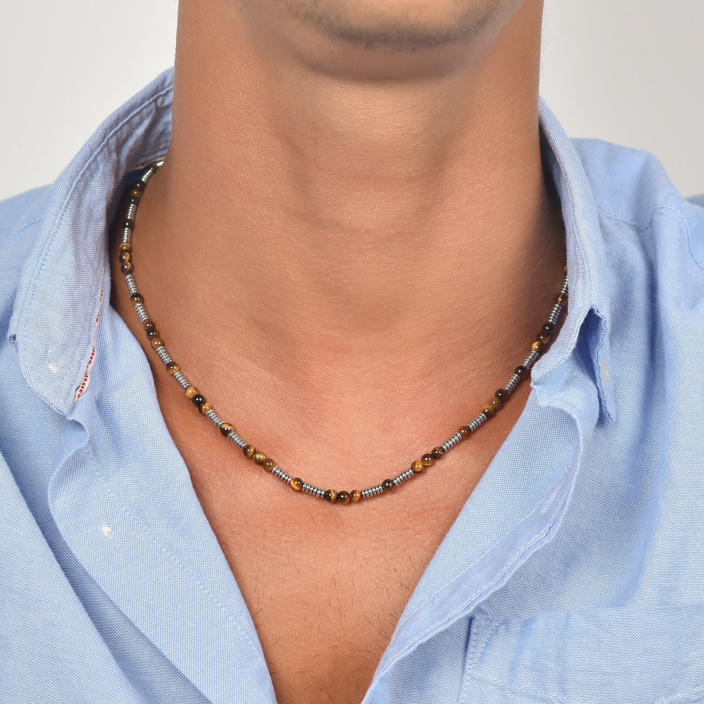 COLLIER HOMME EN ACIER AVEC PIERRES EN OEIL DE TIGRE ET ÉLÉMENTS EN ACIER