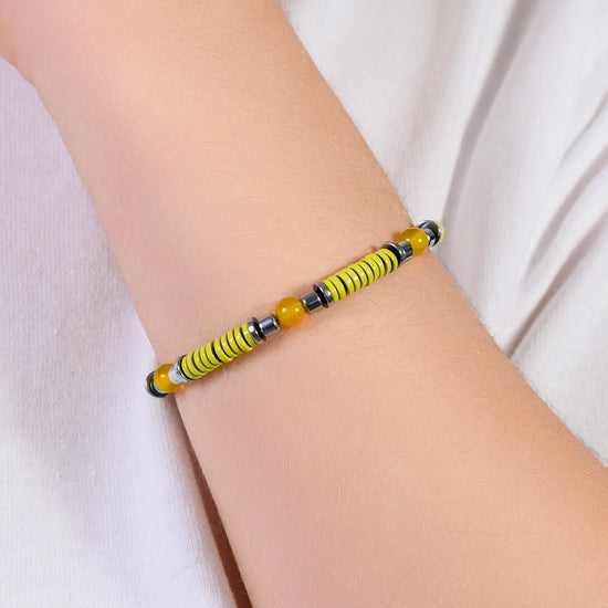 BRACELET FILLE EN ACIER AVEC PIERRES JAUNES ET ÉLÉMENTS EN ÉMAIL JAUNE