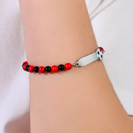 BRACELET BÉBÉ EN ACIER AVEC PIERRES ROUGES ET NOIRES