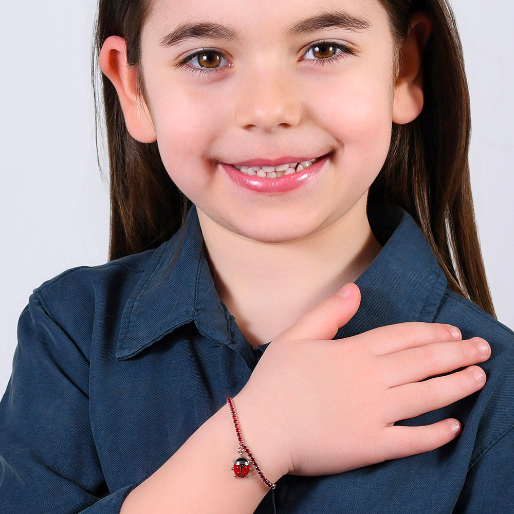 BRACELET DE TENNIS EN ACIER POUR FILLE AVEC CRISTAUX ROUGES ET COCCINELLE