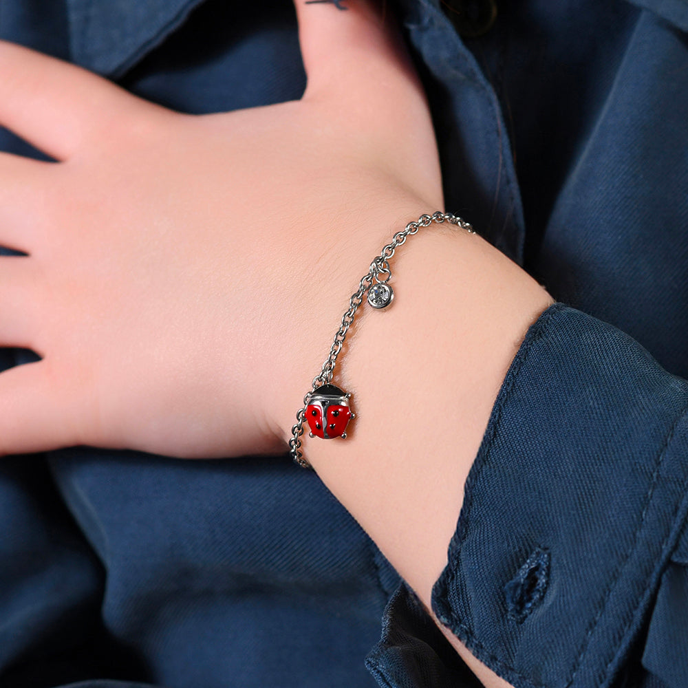 BRACELET FILLE EN ACIER AVEC COCCINELLE EN ÉMAIL ROUGE ET NOIR ET CRISTAL