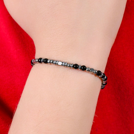 BRACELET BÉBÉ EN ACIER AVEC PIERRES NOIRES ET GRISES