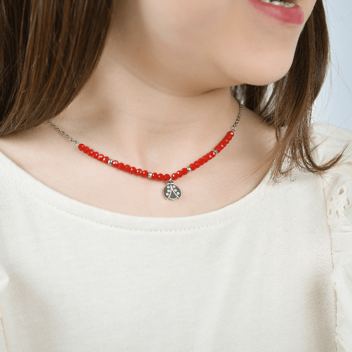 COLLIER POUR FILLE EN ACIER AVEC PIERRES ROUGES ET COCCINELLE