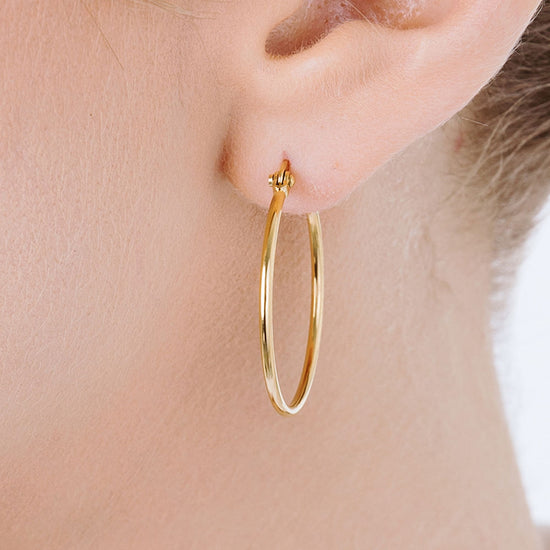 BOUCLES D'OREILLES CERCLÉES EN ACIER DE 25 MM DE DIAMÈTRE POUR FEMMES